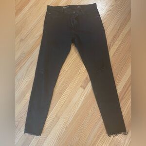 A Golde black skinny jeans with ripped knees size 32